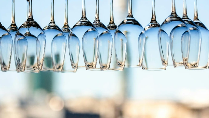 tilt shift lens photography of clear glass bottles